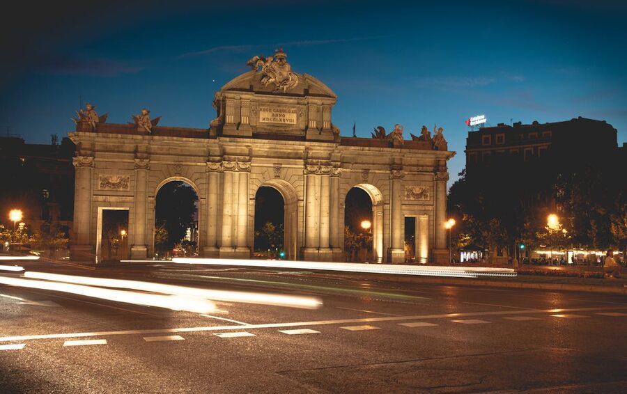 The Puerta de Alcala monument illuminated at night in Madrid