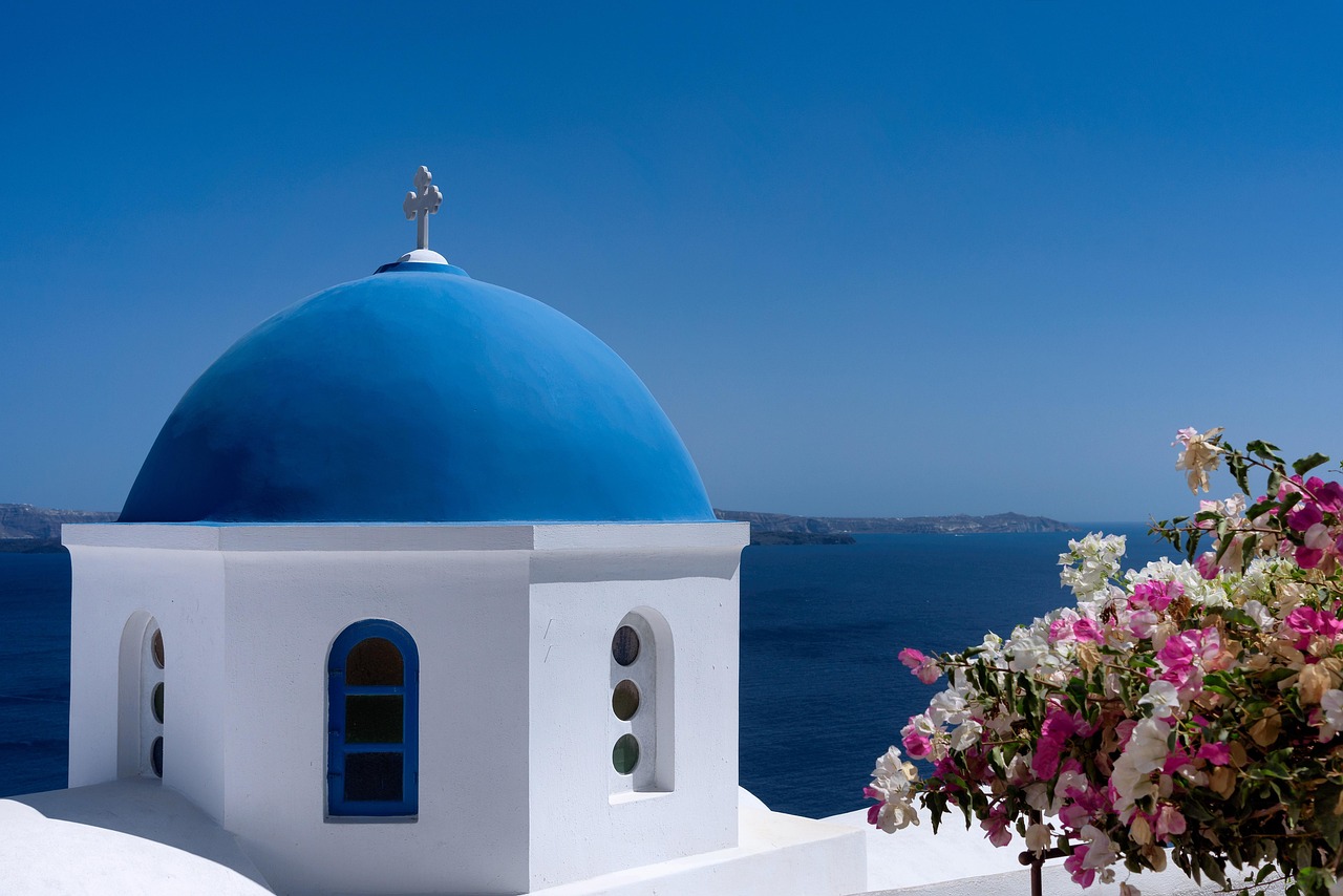 Blue dome church overlooking the caldera in Santorini