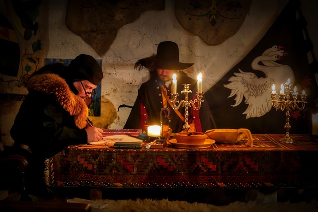 Men dressed as medieval lords sitting at a candlelit stone table