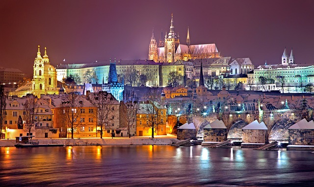 Prague Castle and Charles Bridge at night in winter