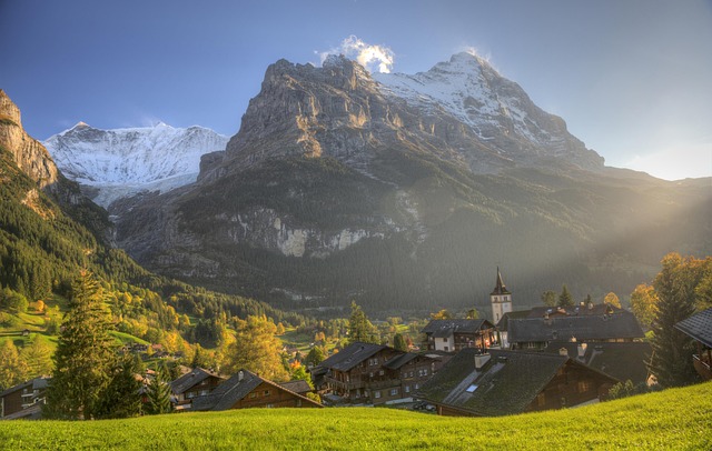 Grindelwald village with traditional wooden chalets and the Eiger mountain in autumn