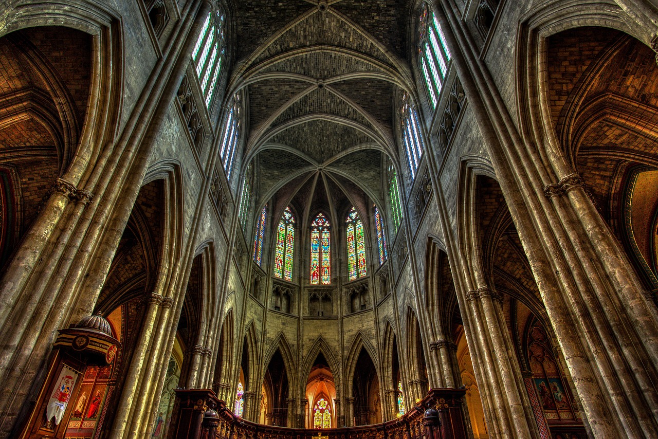 Interior of Bordeaux cathedral showing Gothic arches and stained glass windows