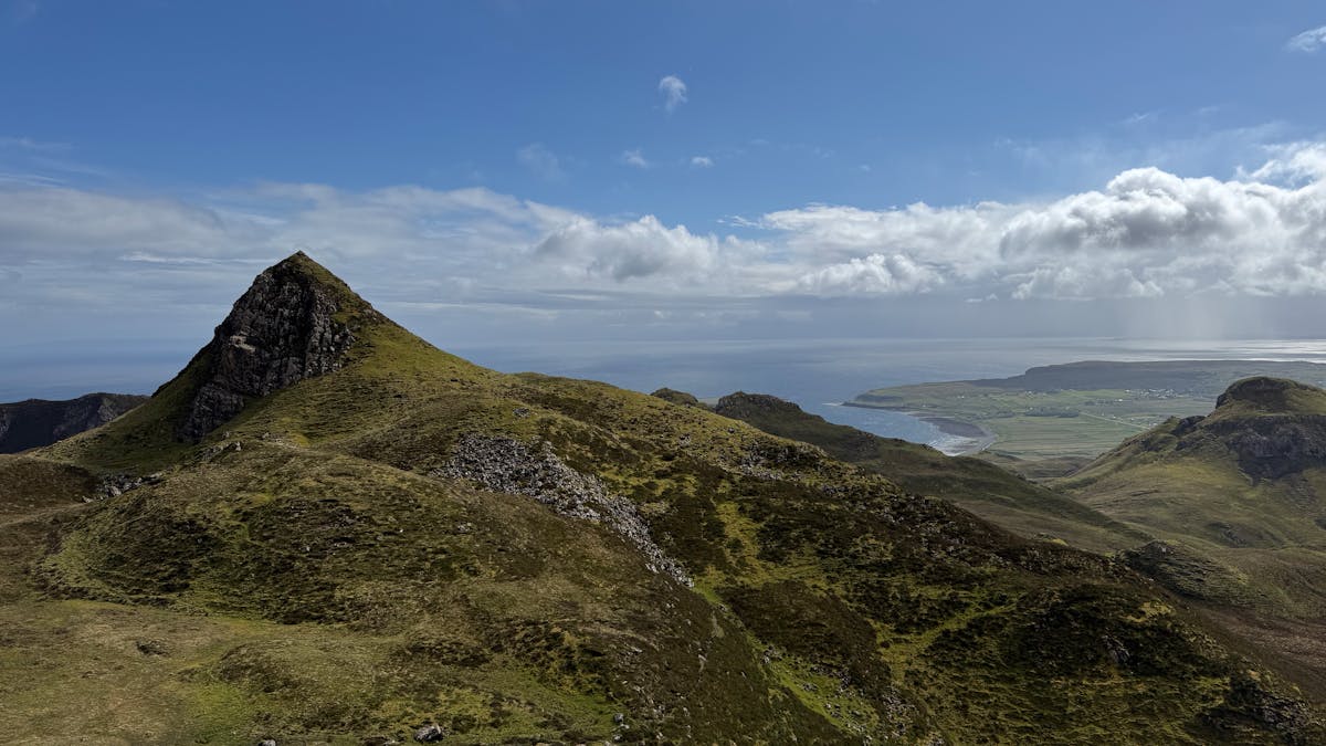 Rolling green hills and dramatic landscape of the Quiraing on the Isle of Skye