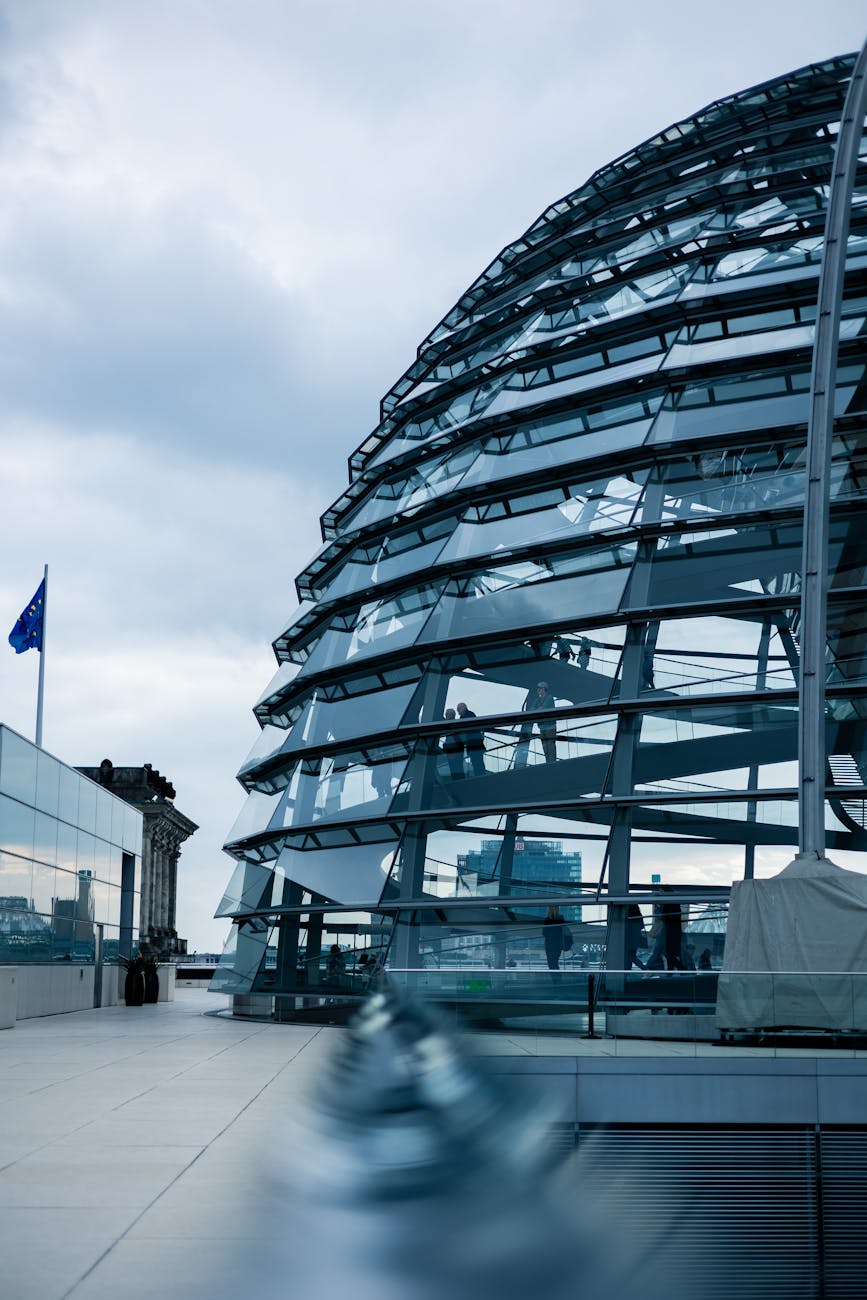 The glass dome of the Reichstag building in Berlin against a grey sky