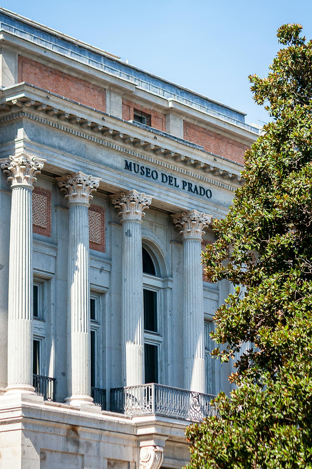 Elegant neoclassical facade of Museo del Prado in Madrid on a sunny day
