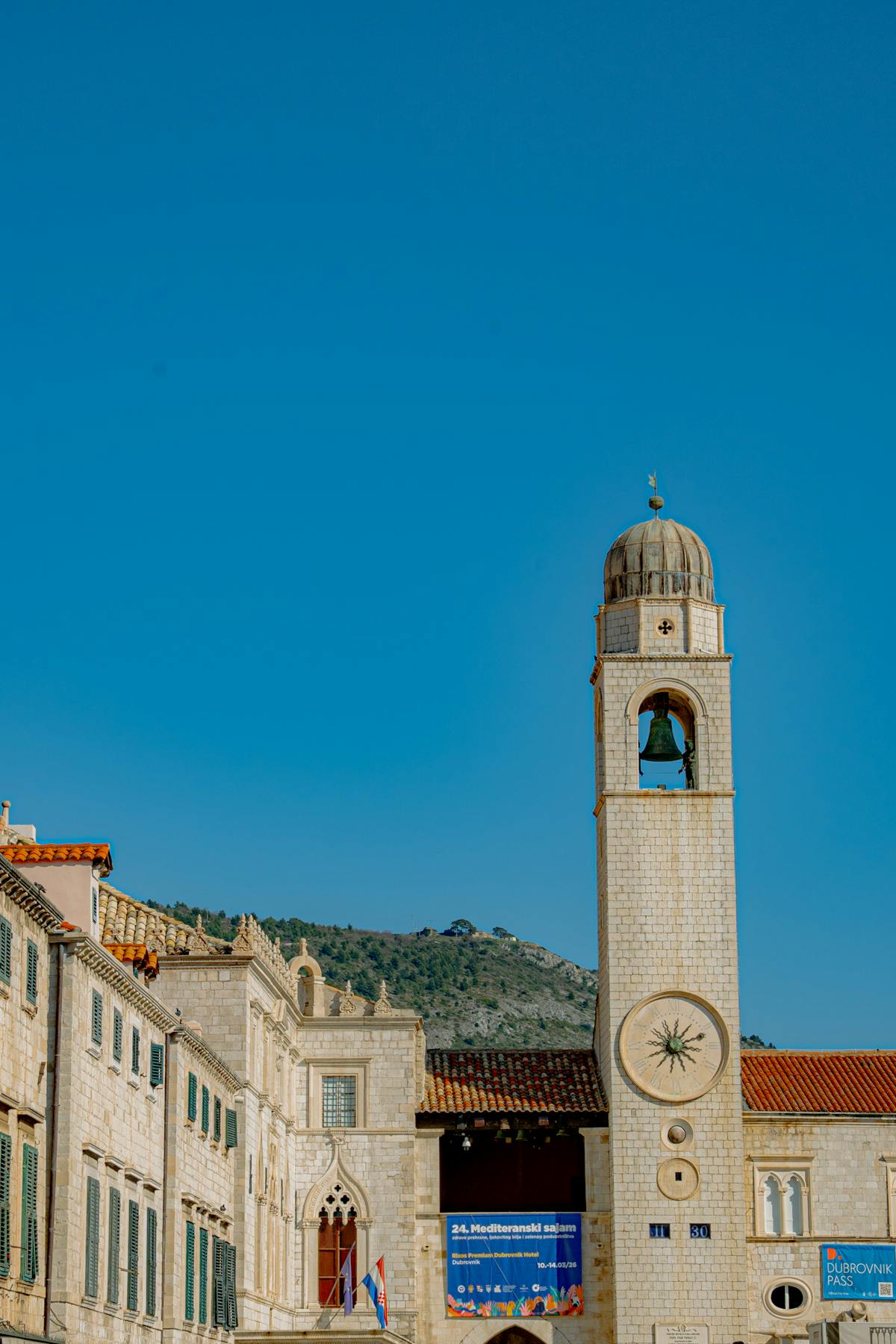 Dubrovnik bell tower under clear blue sky