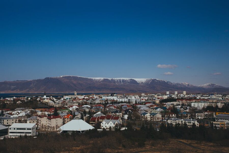 Aerial Reykjavik cityscape with mountains