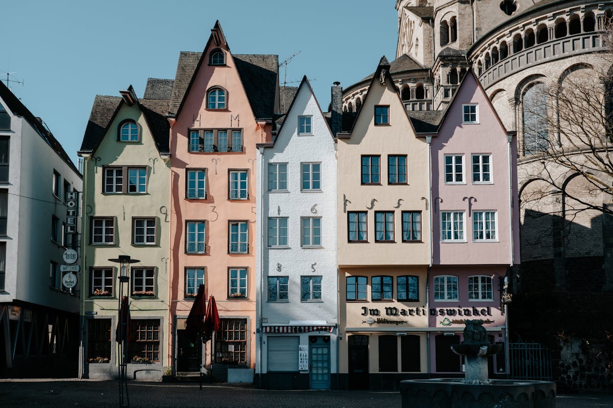 Charming historic buildings with colorful facades in a Cologne square