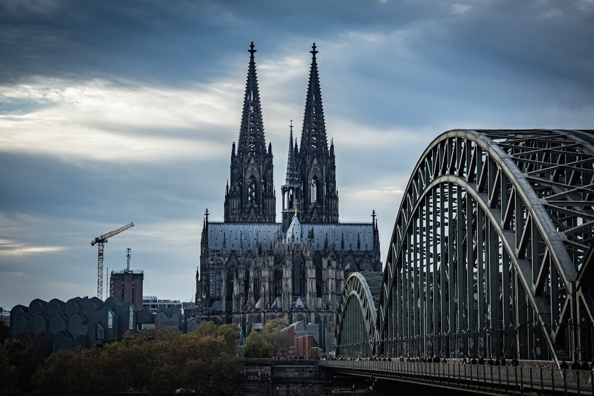 Cologne Cathedral and Hohenzollern Bridge in dramatic lighting