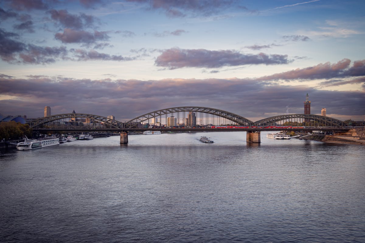 Aerial view of the Hohenzollern Bridge and Rhine River in Cologne Germany at dusk