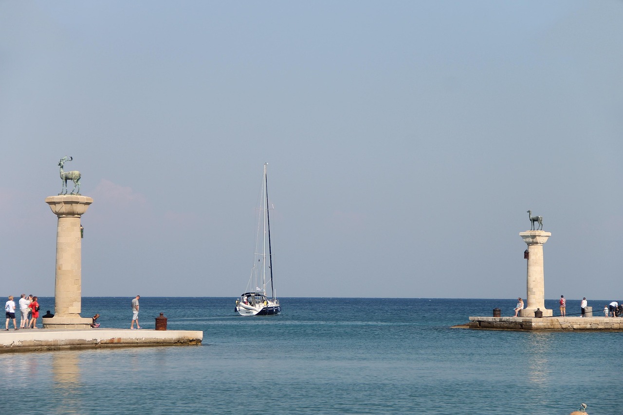 Mandraki Harbour entrance in Rhodes with deer statues