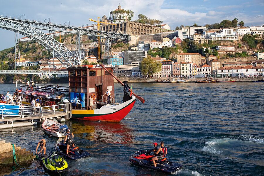 Tourists walking along the riverside in Ribeira Porto