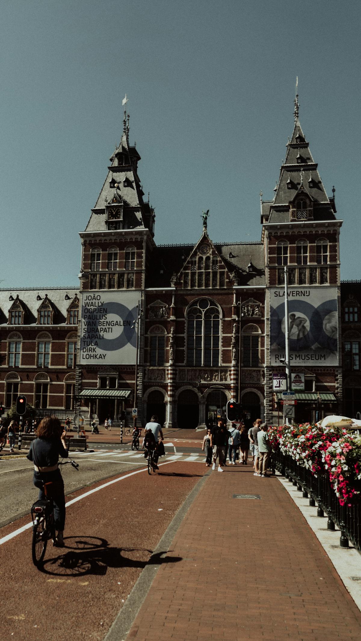 Cyclists enjoying a sunny day by the Rijksmuseum