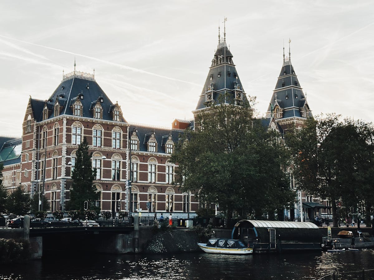 Rijksmuseum building viewed from an Amsterdam canal
