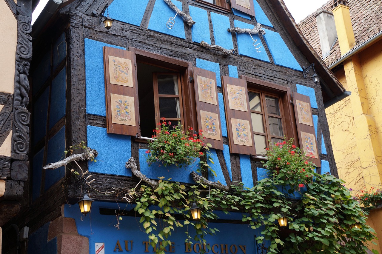 Colorful half-timbered buildings along a street in Riquewihr Alsace