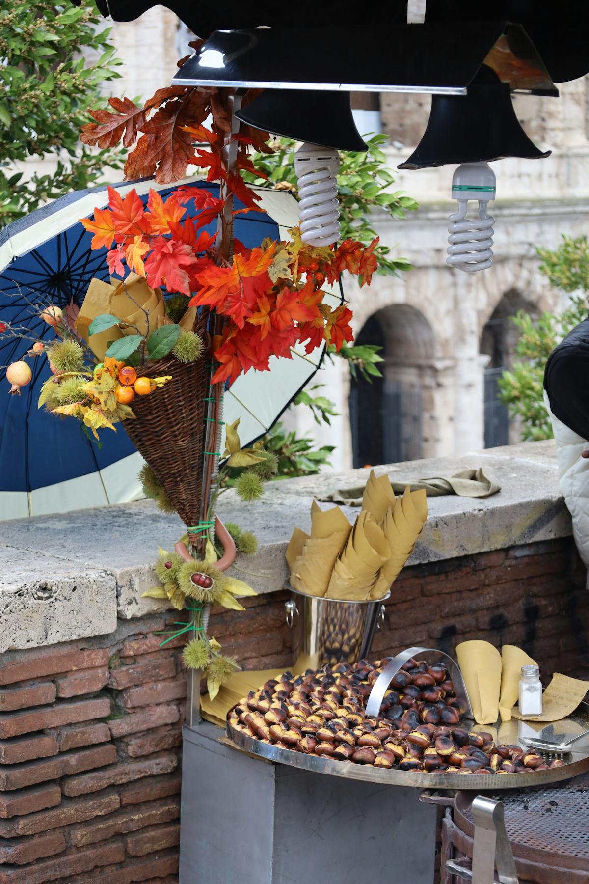Vibrant street market in Rome with autumn atmosphere near a historic landmark