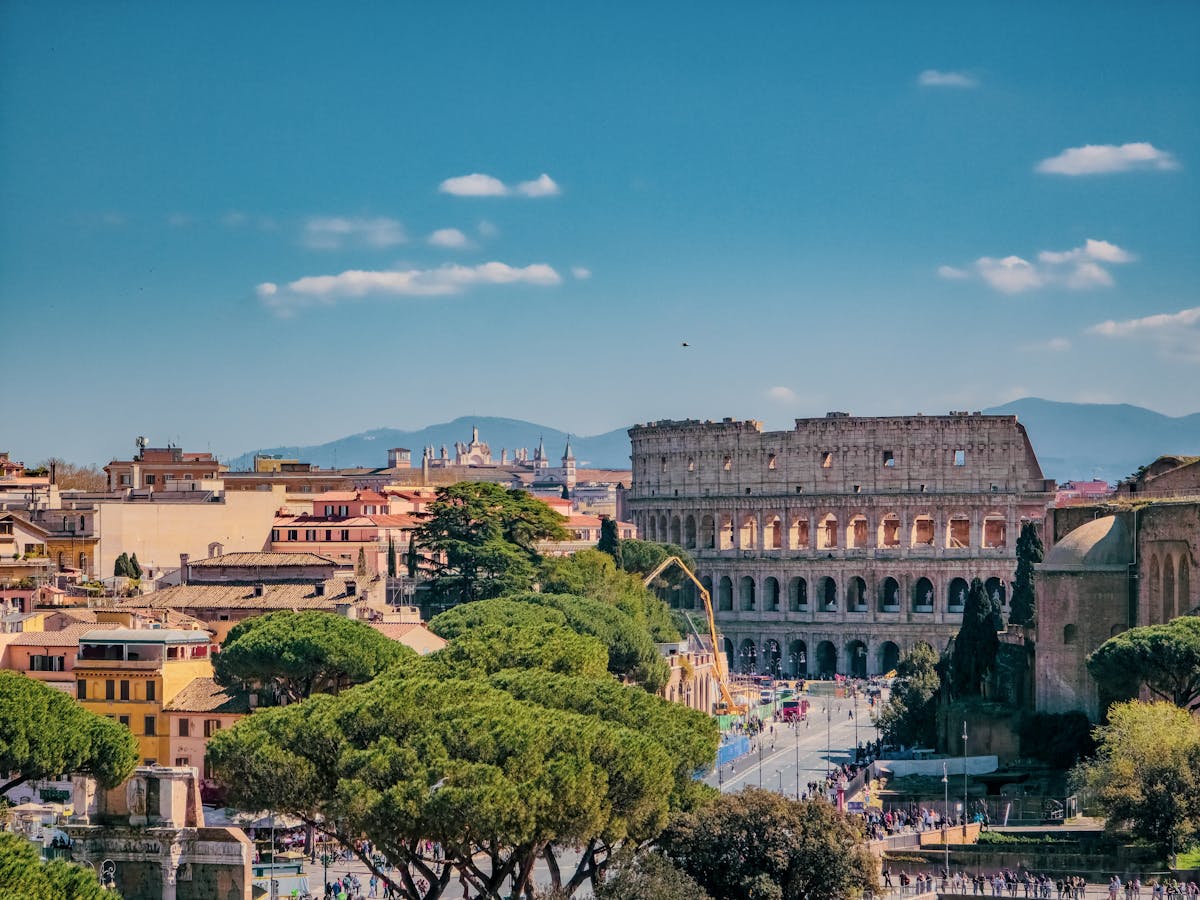 Panoramic view of Rome featuring the Colosseum on a sunny day