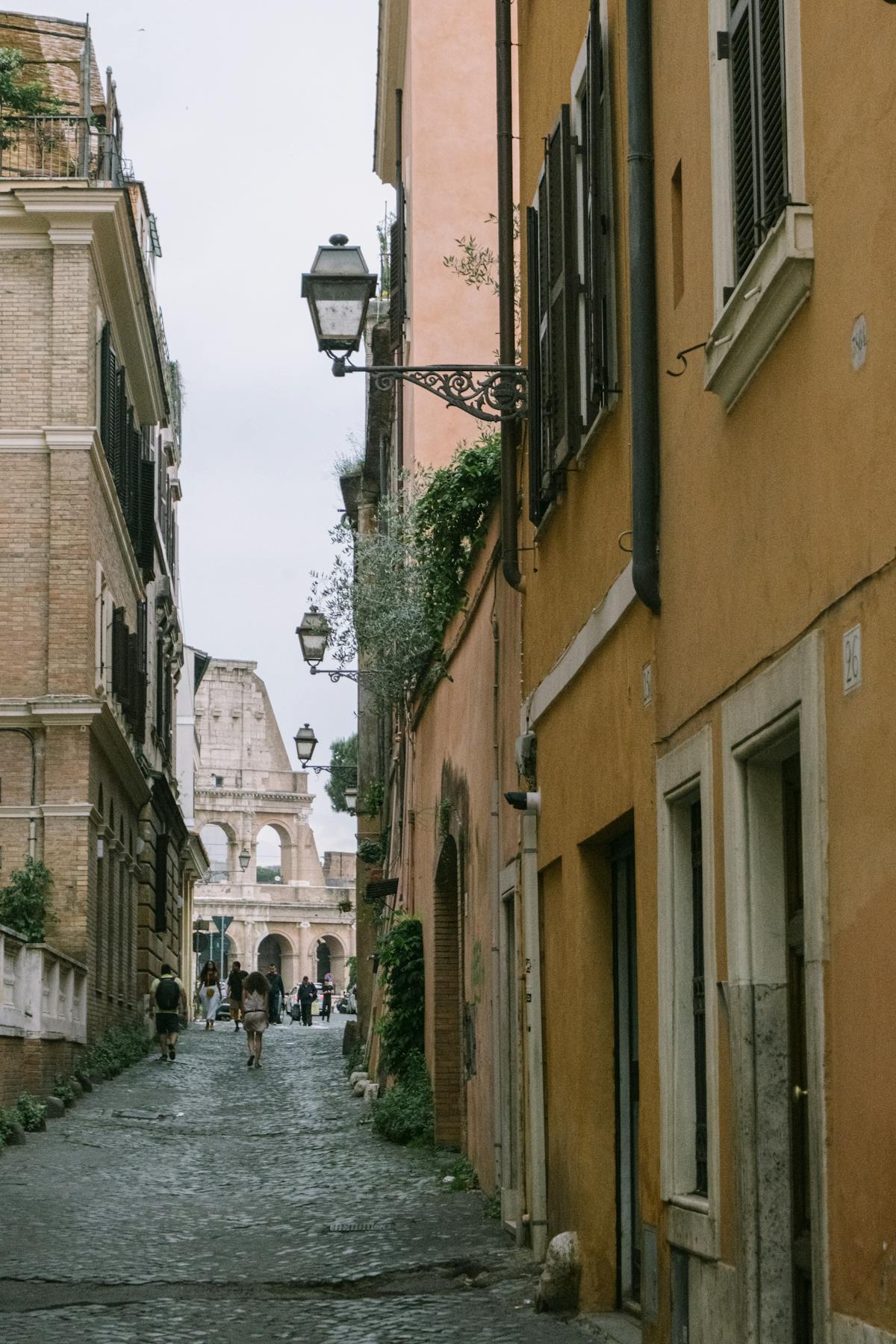 Street in Rome with the Colosseum visible in the distance