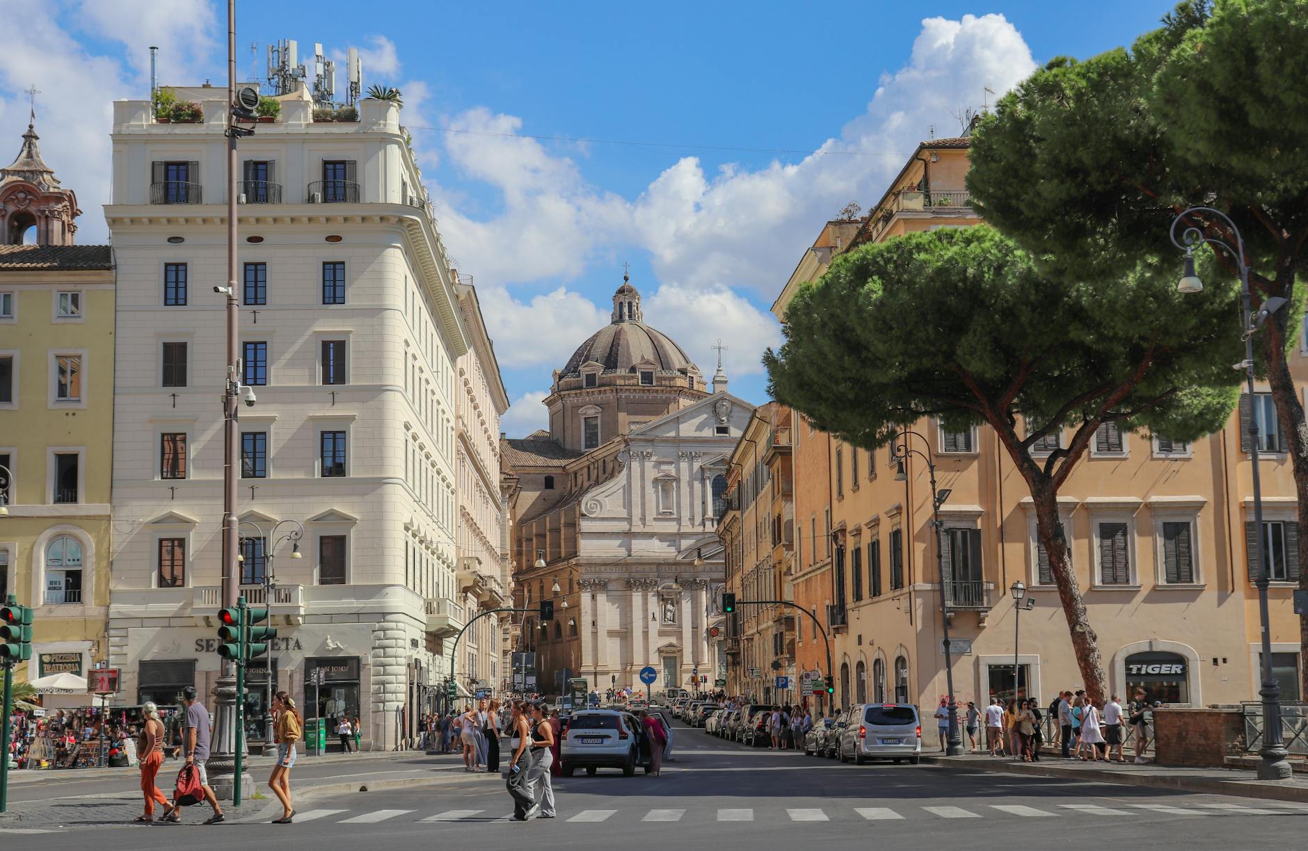 A sunny street in Rome with historic buildings
