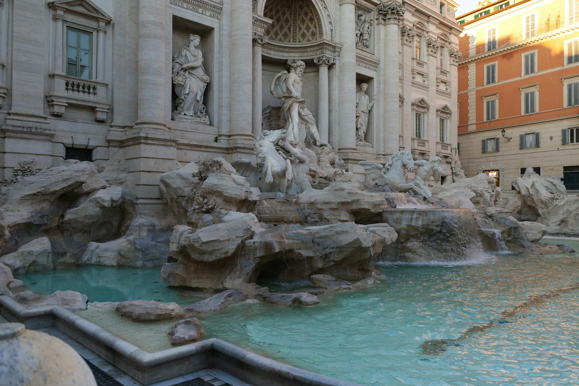 The Trevi Fountain in Rome during daytime with turquoise water