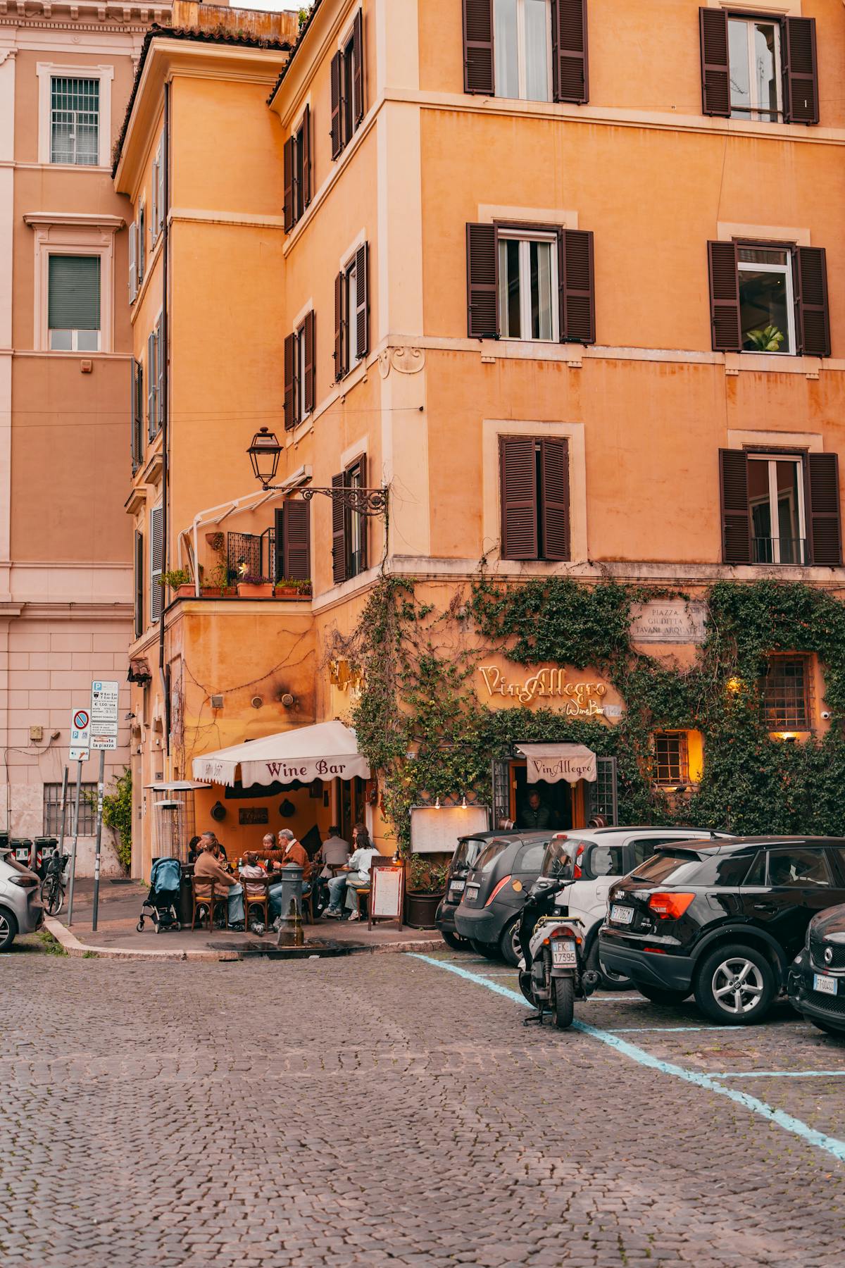 Cozy outdoor wine bar on a charming street in Rome