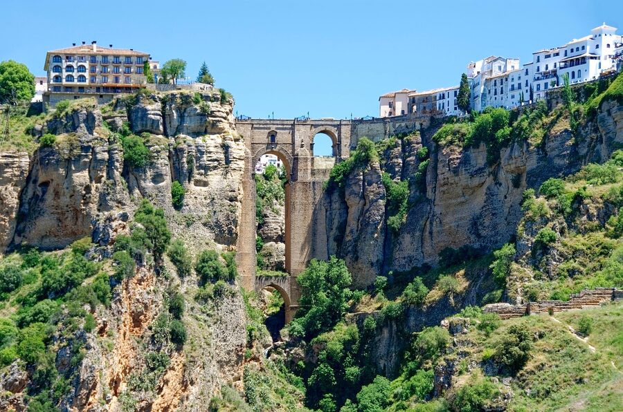 Ronda city buildings on rock plateau above gorge