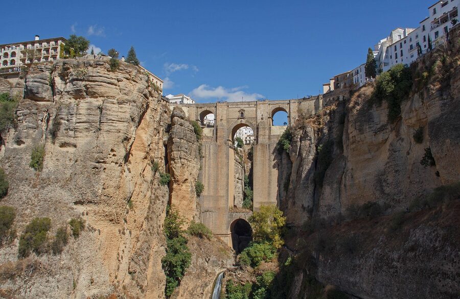 Ronda New Bridge with ruins and white buildings Andalusia