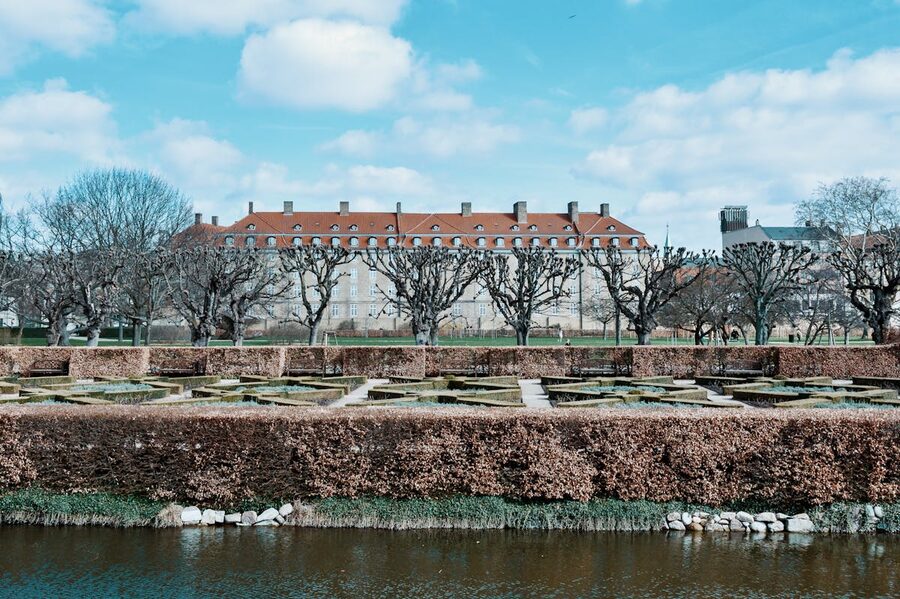 Winter view of Rosenborg Castle Gardens in Copenhagen with bare trees and paths