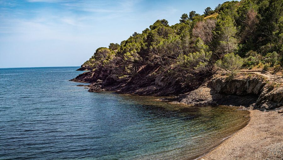 Green coastal hills and rocky shoreline near Roses in Catalunya with the Mediterranean below