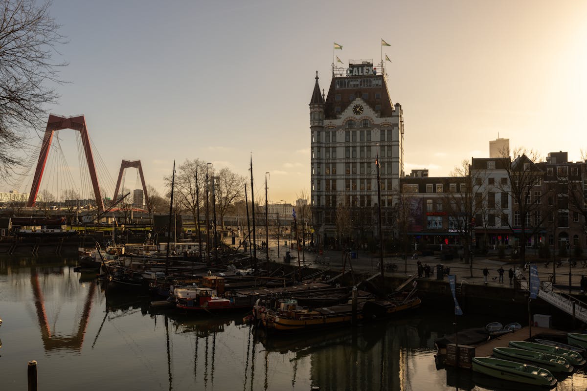 Willemsbrug bridge and the historic White House building in Rotterdam at sunset