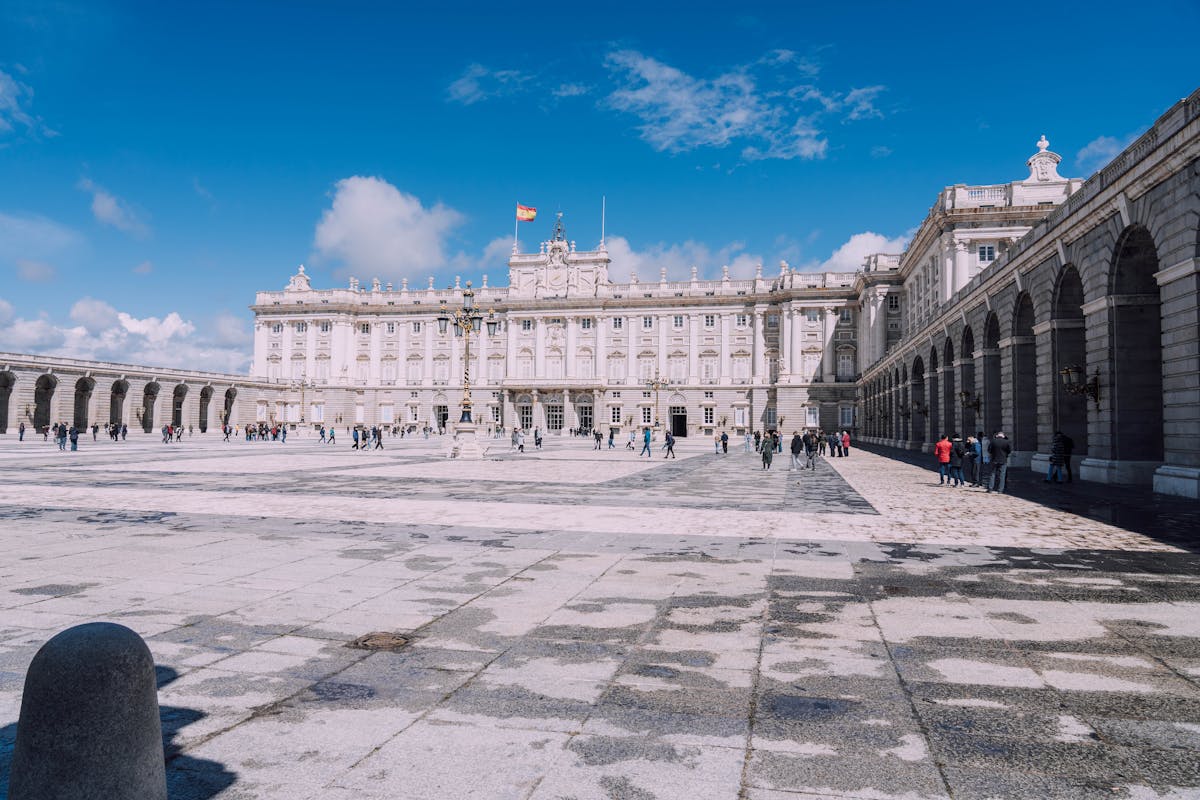 The Royal Palace of Madrid standing tall under a bright blue sky