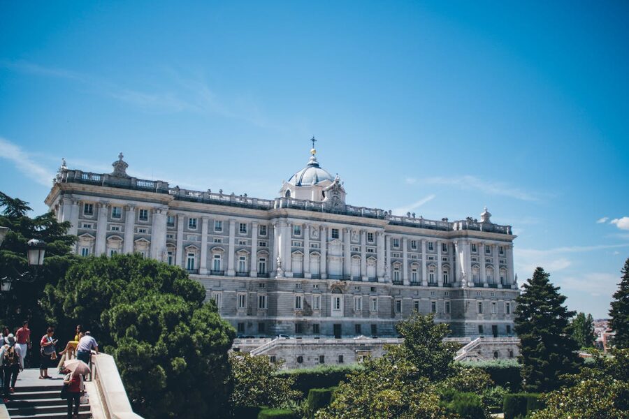 The Royal Palace of Madrid with trees and greenery in daytime