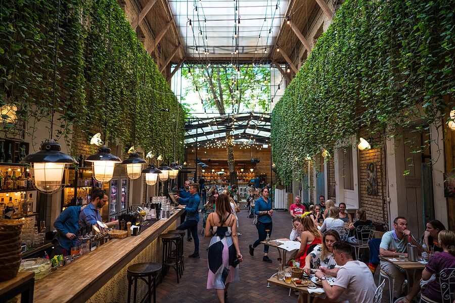 Mazel Tov ruin bar courtyard with glass roof in Budapest Jewish Quarter