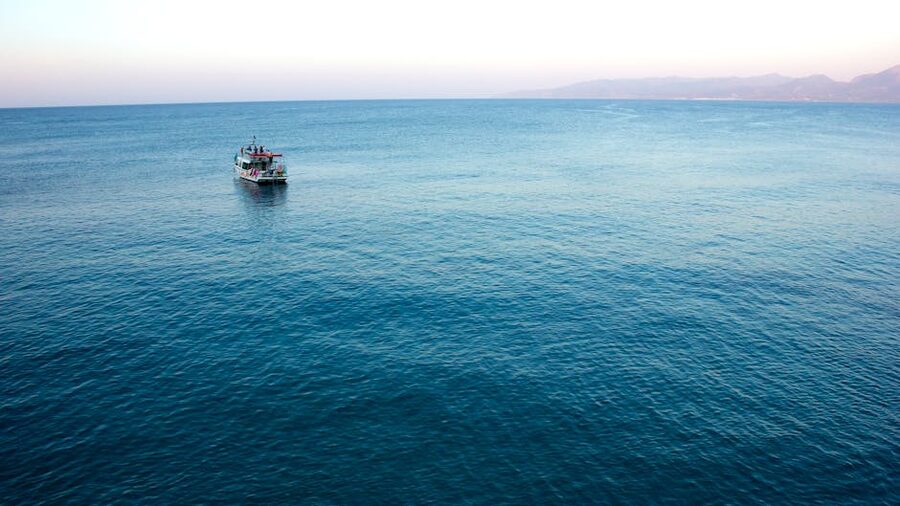 Sailing on the Aegean with mountains horizon