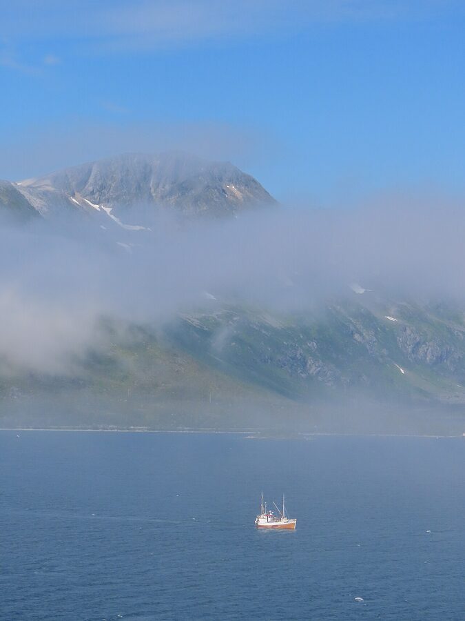 Sailing into Tromso fjords from boat deck