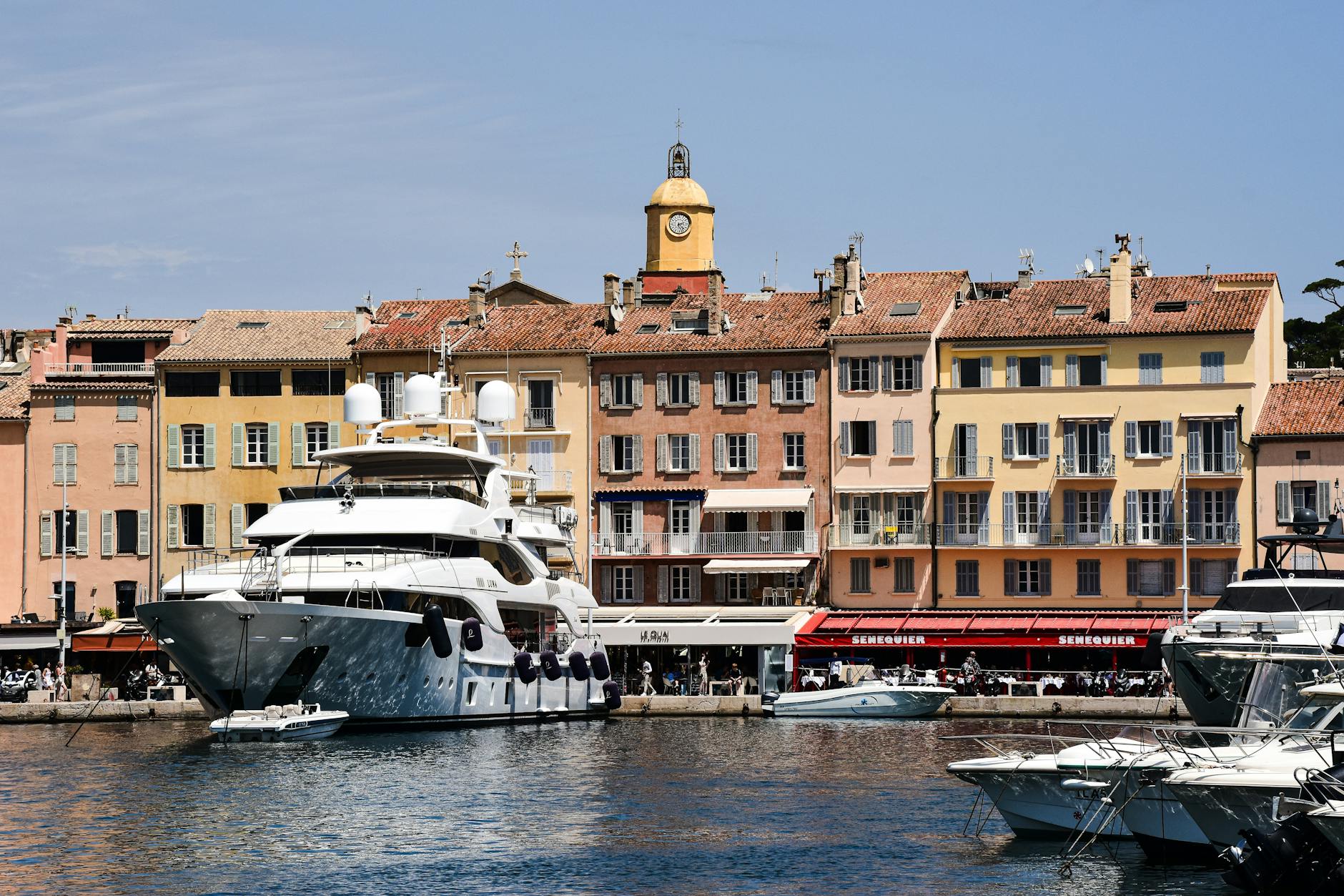 Row of luxury yachts moored in Saint-Tropez harbor