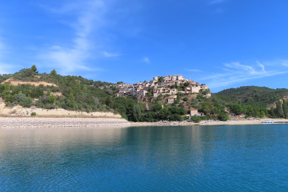 Village of Sainte-Croix-du-Verdon perched on a hillside overlooking the lake in Provence