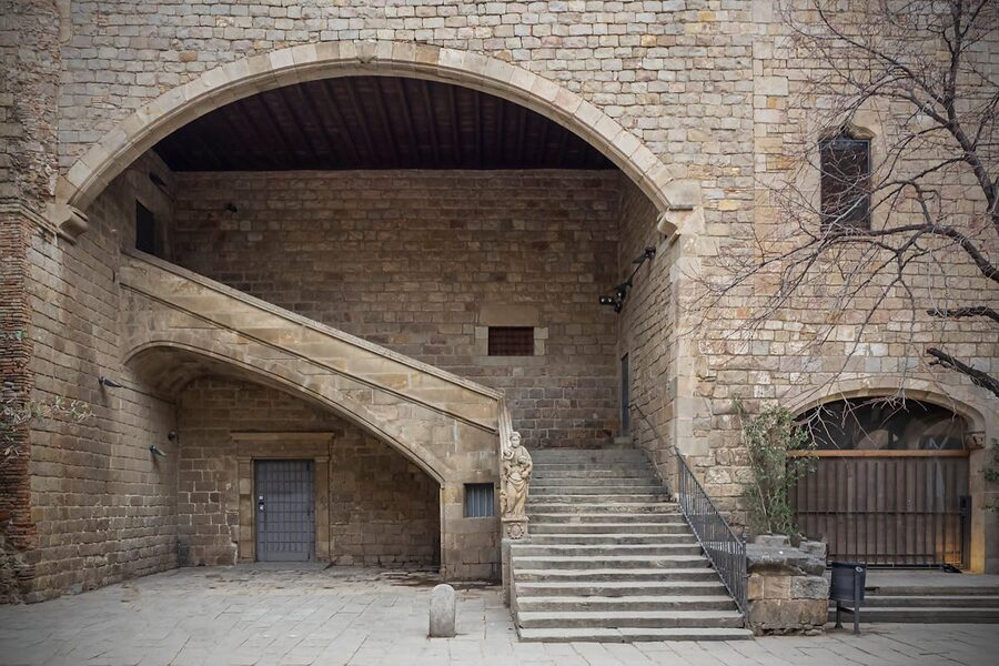 Stone courtyard of the old Hospital de la Santa Creu in Barcelona Gothic Quarter