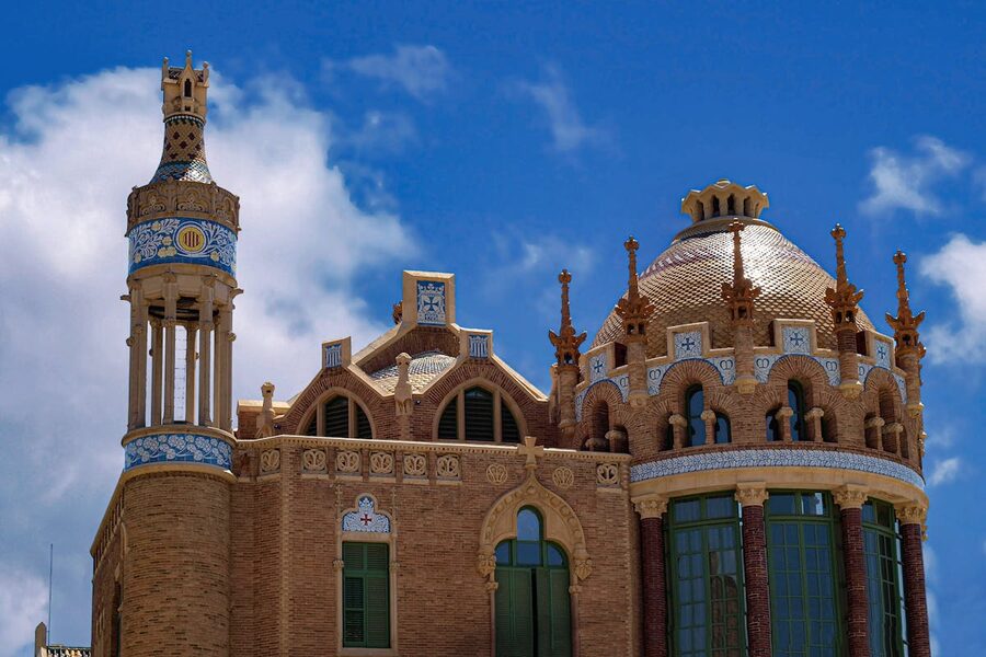 Detailed view of ornate towers and brickwork at Hospital de Sant Pau
