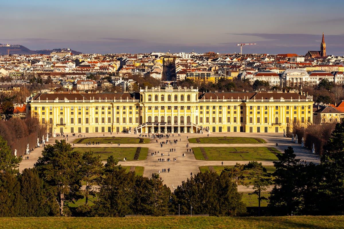 Aerial view showing the vast gardens and geometric hedges of Schonbrunn Palace