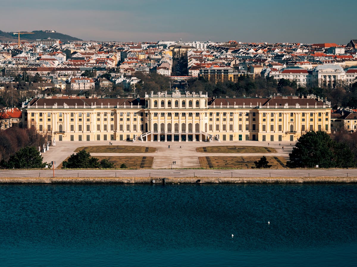 Front view of Schonbrunn Palace showing the iconic yellow baroque facade