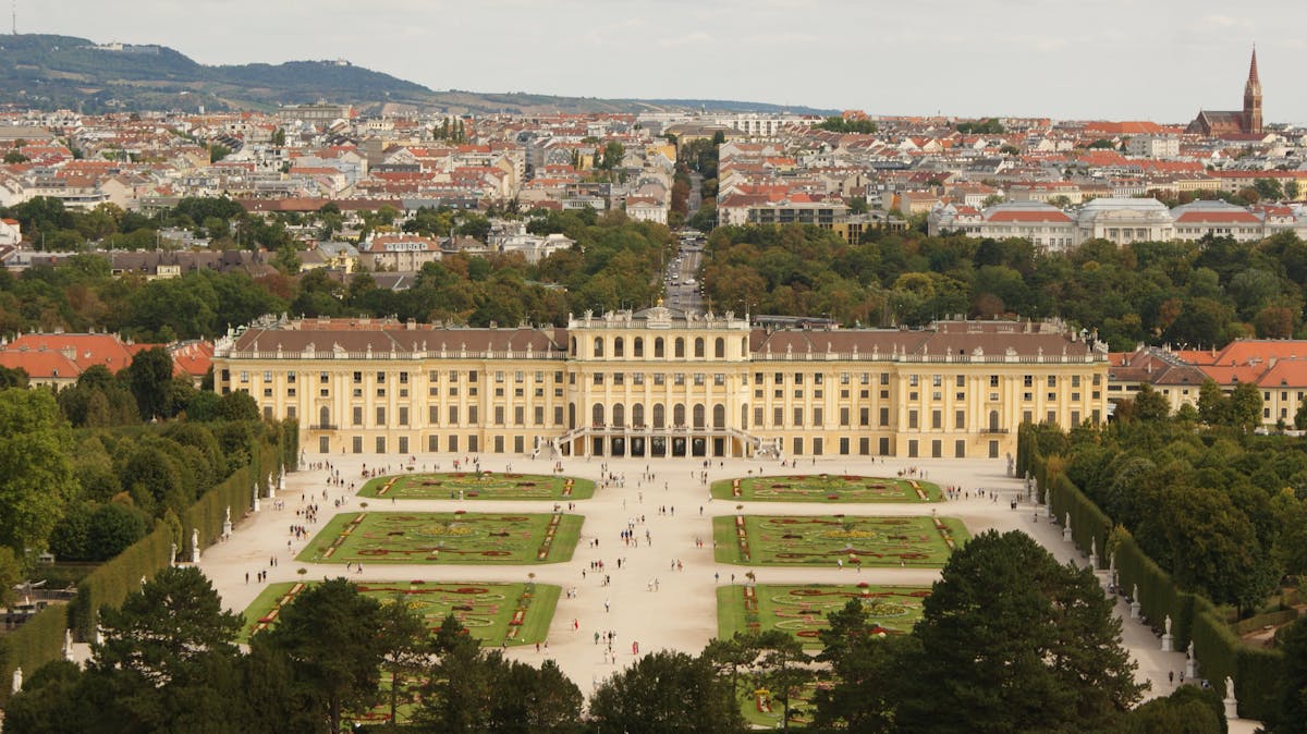 High angle view looking down over Schonbrunn Palace with the city of Vienna in the background