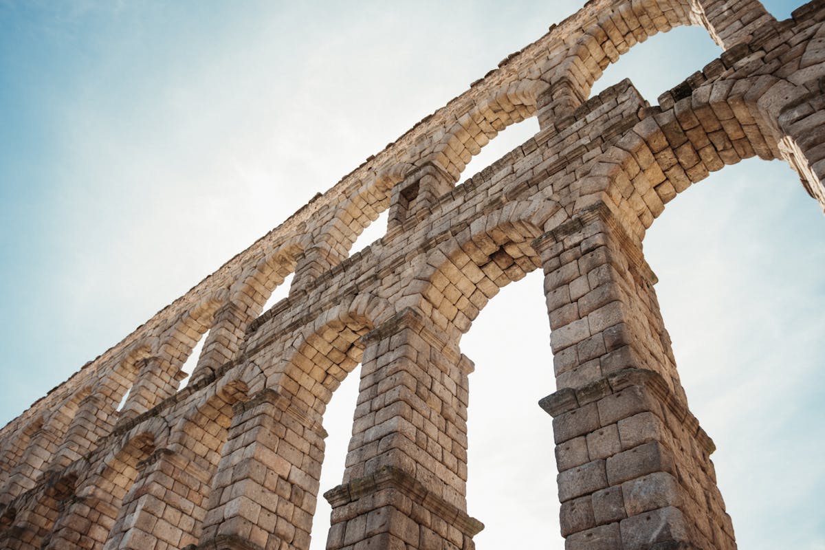 Close-up view of the Roman aqueduct of Segovia showing the precise stonework between the arches
