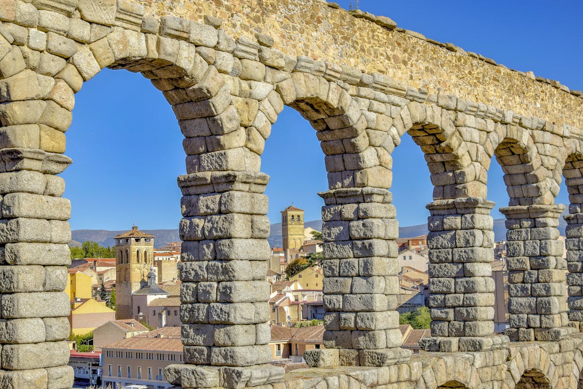 Architectural detail of historic buildings in Segovia showing ornate stonework