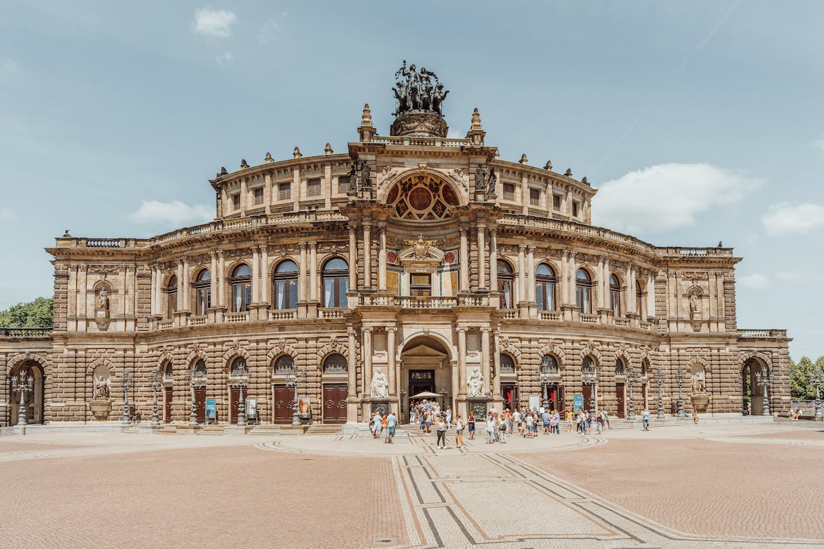 The Semperoper Opera House in Dresden under clear blue skies showing its Neo-Renaissance facade