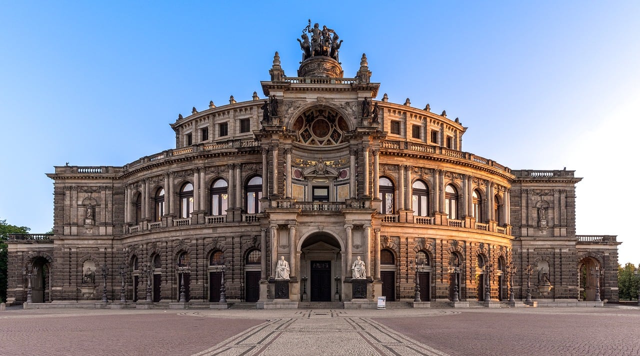 The Semperoper opera house at sunrise with warm light on its facade