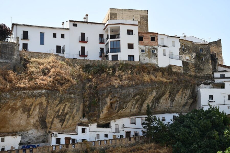 Cliffside houses built into rock face in Setenil de las Bodegas Spain