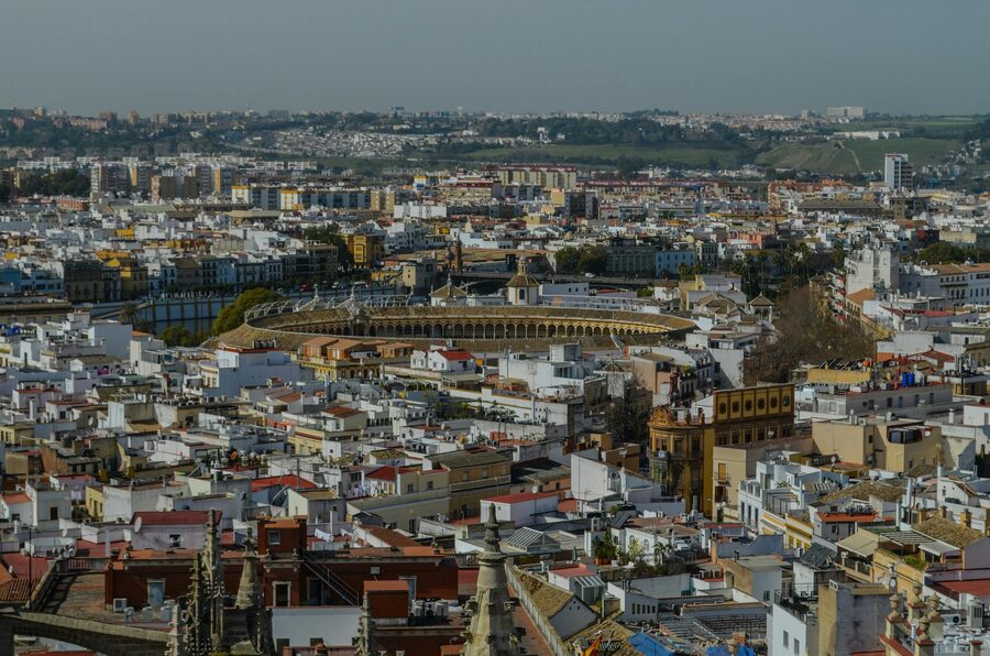 Aerial view of the Seville bullring within the city skyline
