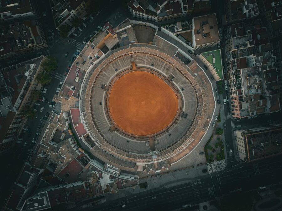 Seville bullring from above with the city extending behind it