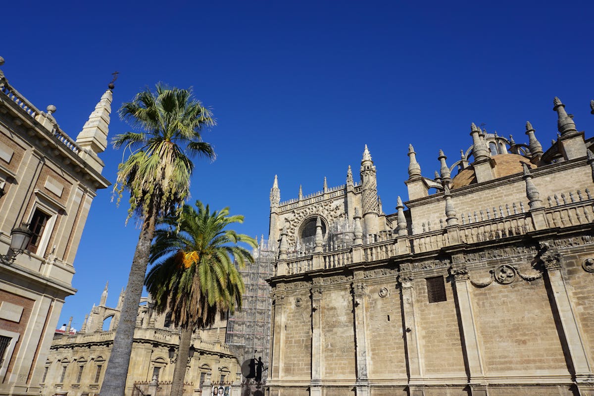 The Patio de los Naranjos courtyard at Seville Cathedral with orange trees and a fountain